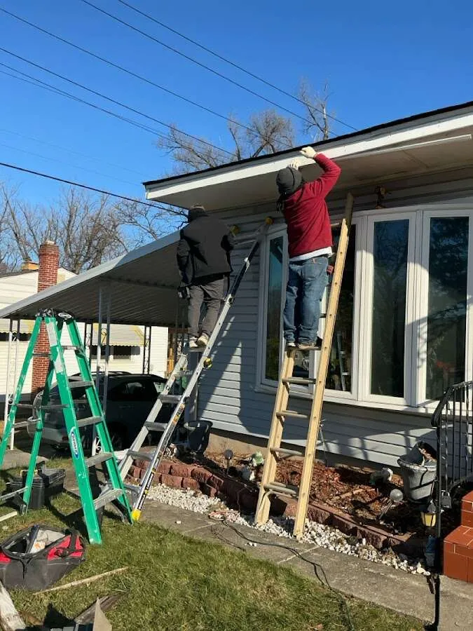 Restoration crew performing exterior repair in Eaton